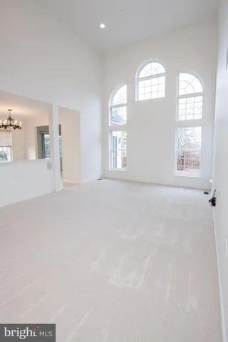 a view of a kitchen with wooden floor and a sink