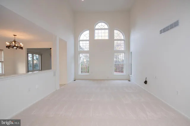 a view of a kitchen with wooden floor and a sink