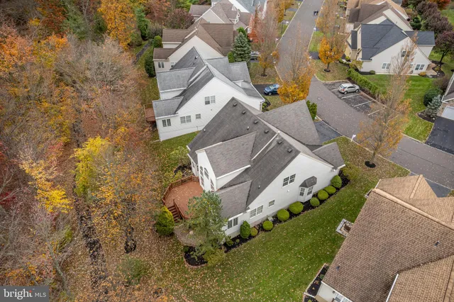 an empty room with windows and exposed bricks