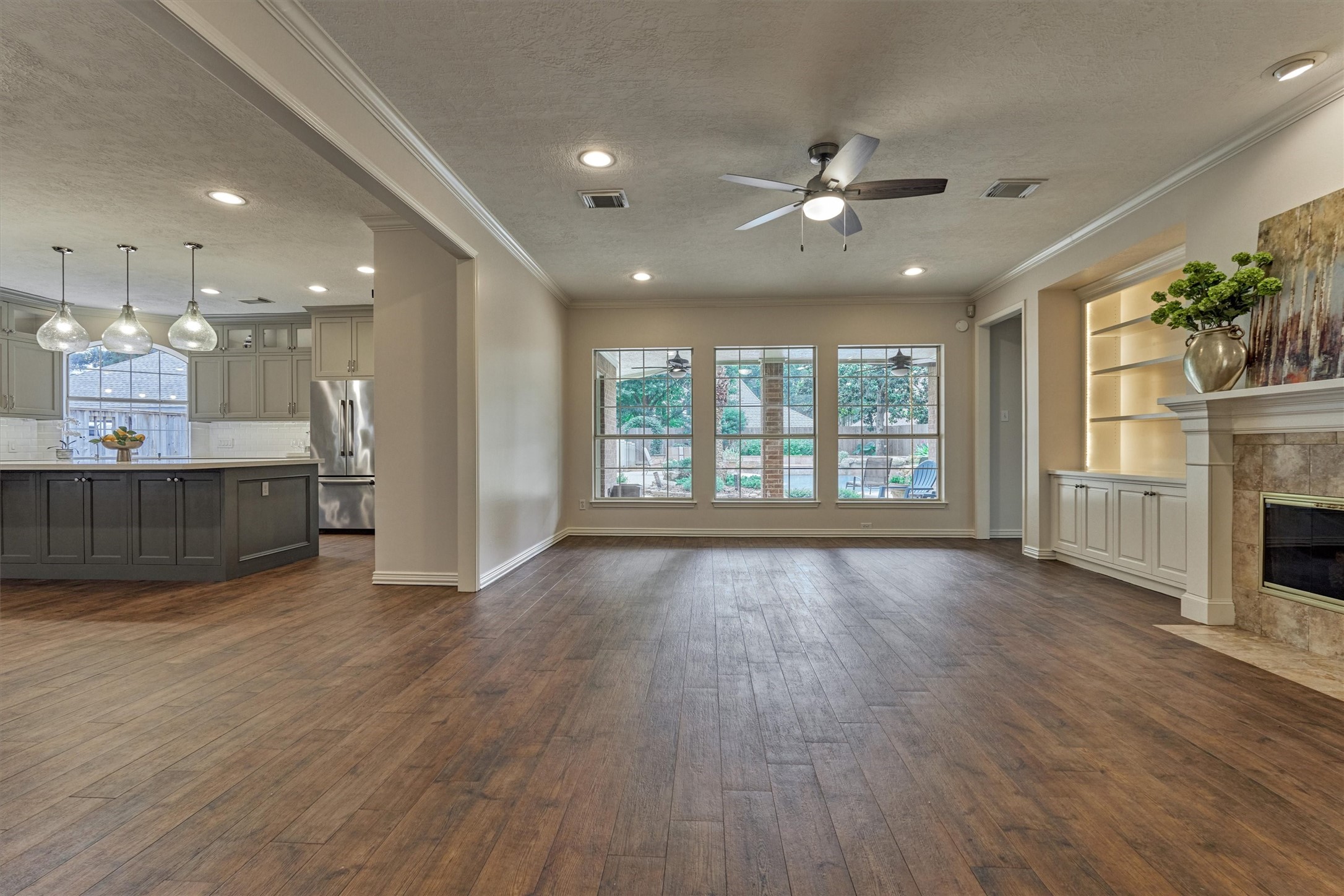 16707 Avenfield Road Tomball, TX 77377 - Photo 17 of 50 an empty room with wooden floor and windows