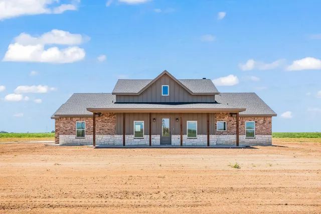 a view of a house with a ocean view