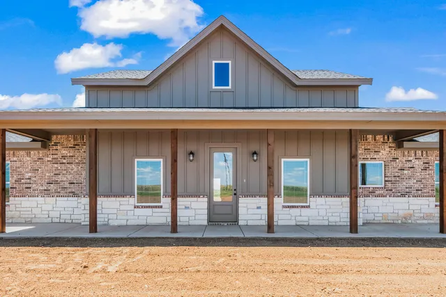 a view of a house with small yard