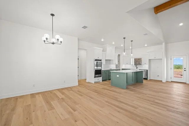 a view of kitchen and kitchen with sink