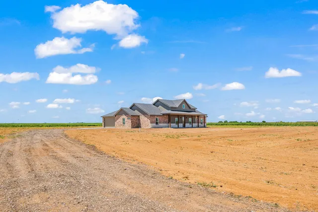 a view of an ocean beach and city