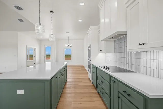 a kitchen with counter top space and stainless steel appliances