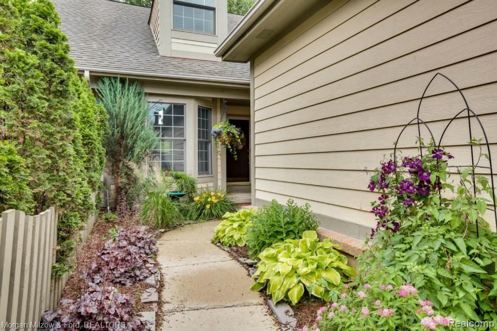 6600 Steeple Ridge, Unit 17 Clarkston, MI 48346 - Photo 1 of 36 Lovely, fenced front walkway