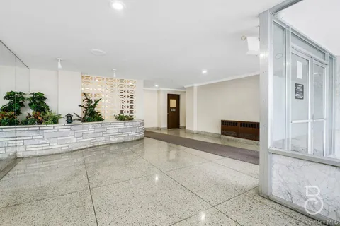 a view of living room filled with furniture and entryway