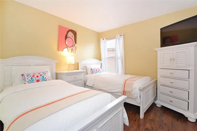 a bedroom with a large bed and a large window