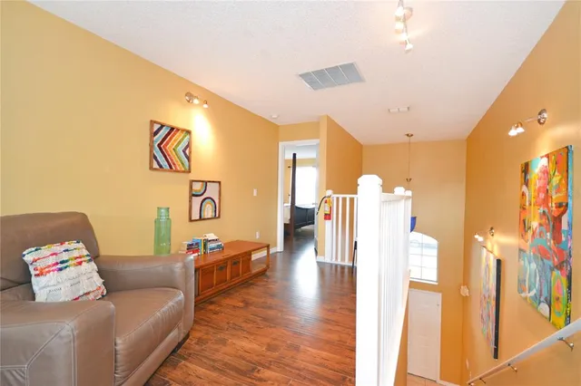 a bathroom with a sink a toilet a mirror and shower