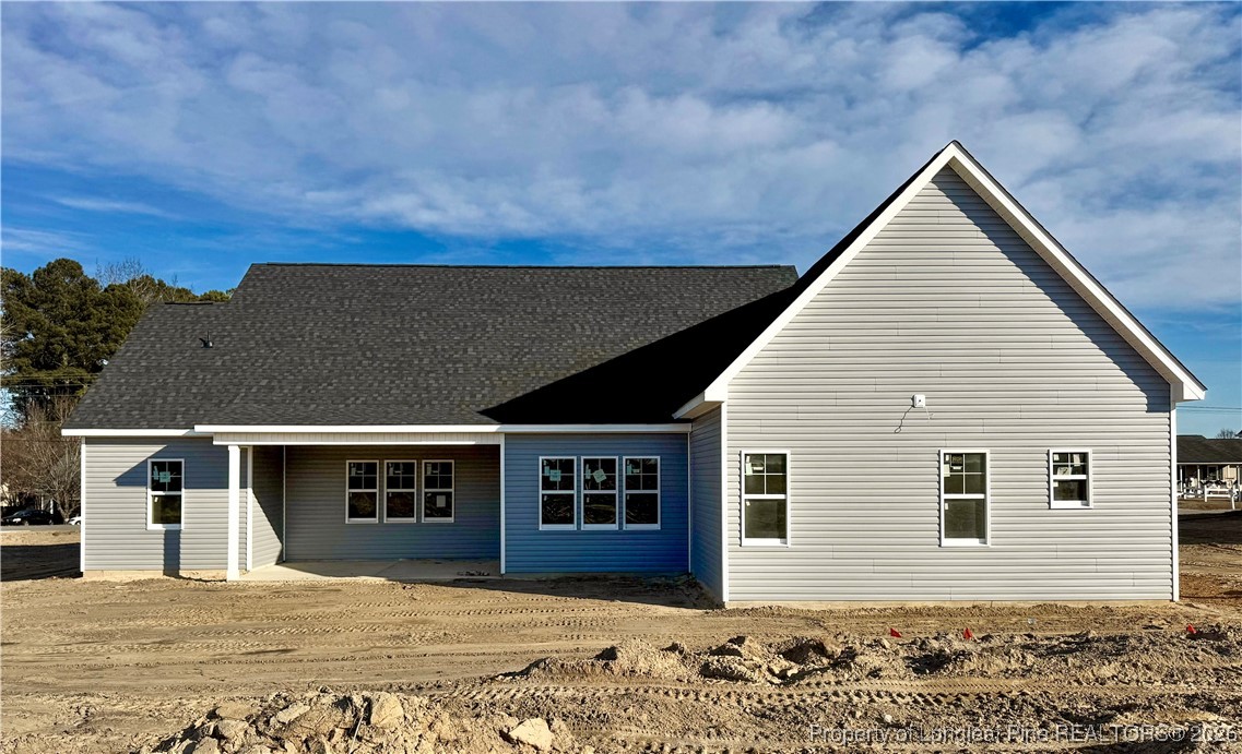 9826 Rockfish Road Raeford, NC 28376 - Photo 2 of 5 a view of a house with a outdoor space