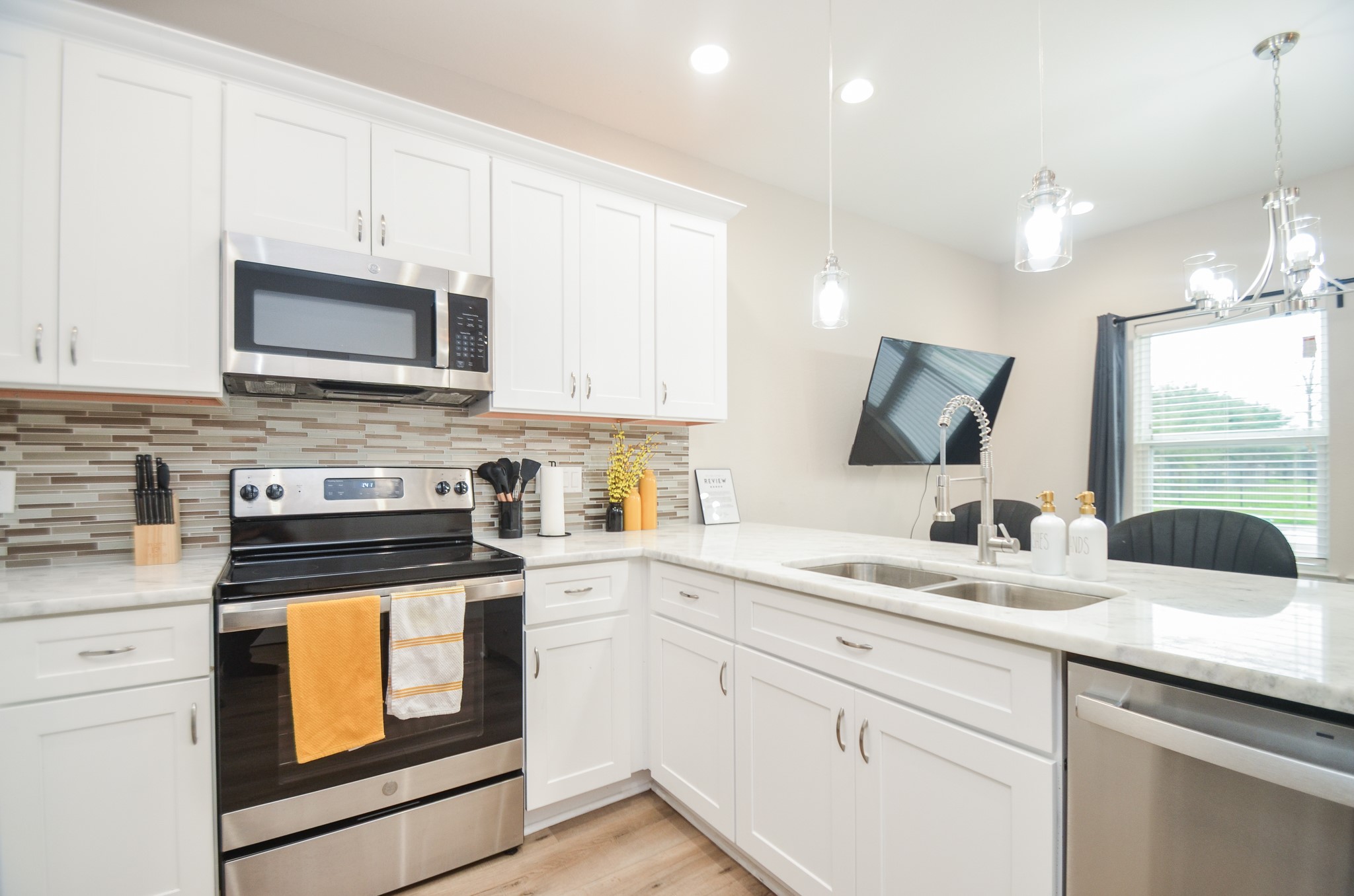 4511 Reed Road Houston, TX 77051 - Photo 13 of 39 a kitchen with granite countertop cabinets stainless steel appliances and sink