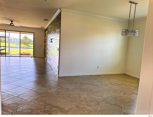 a kitchen with stainless steel appliances granite countertop a refrigerator and a stove