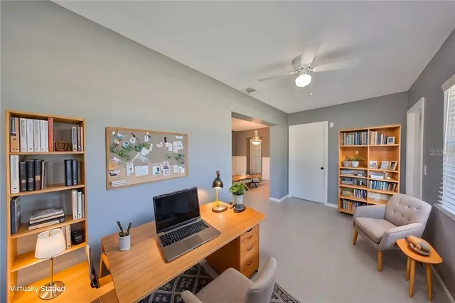 a workspace with furniture and window