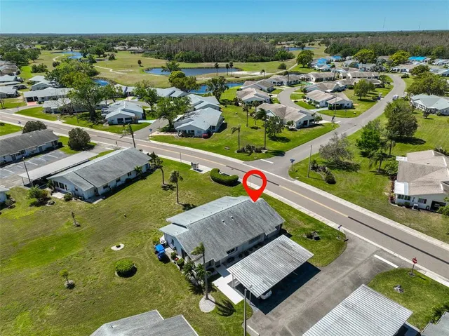 an aerial view of a residential houses with outdoor space