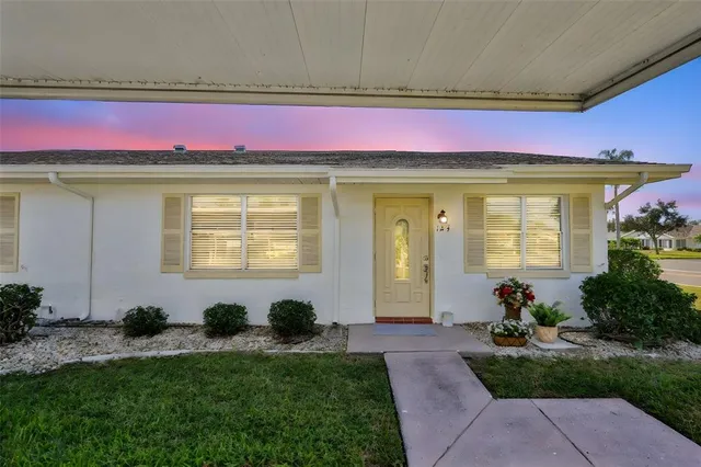 a front view of a house with yard