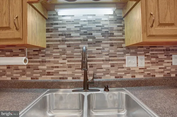a kitchen with a sink and a window