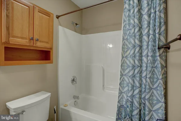 a bathroom with a toilet and shower