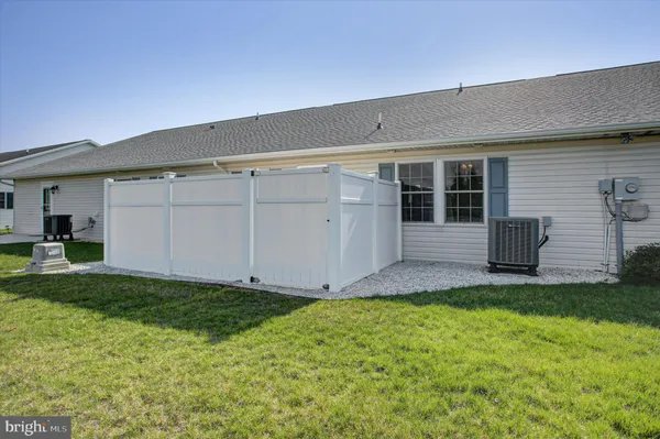 a view of a house with a yard and garage