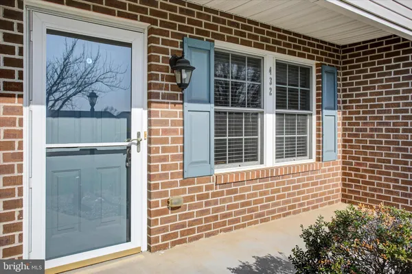 a view of a door of a house with a window