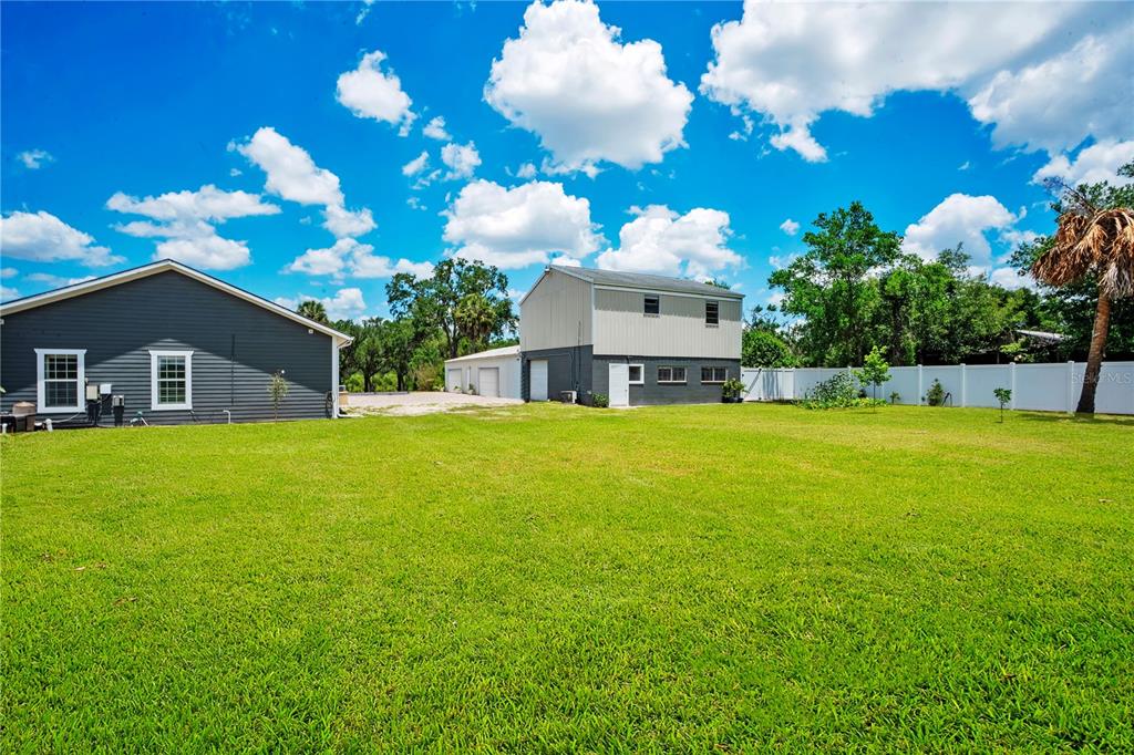 5785 Gilliam Road Orlando, FL 32818 - Photo 62 of 100 a front view of house with an outdoor space and seating area