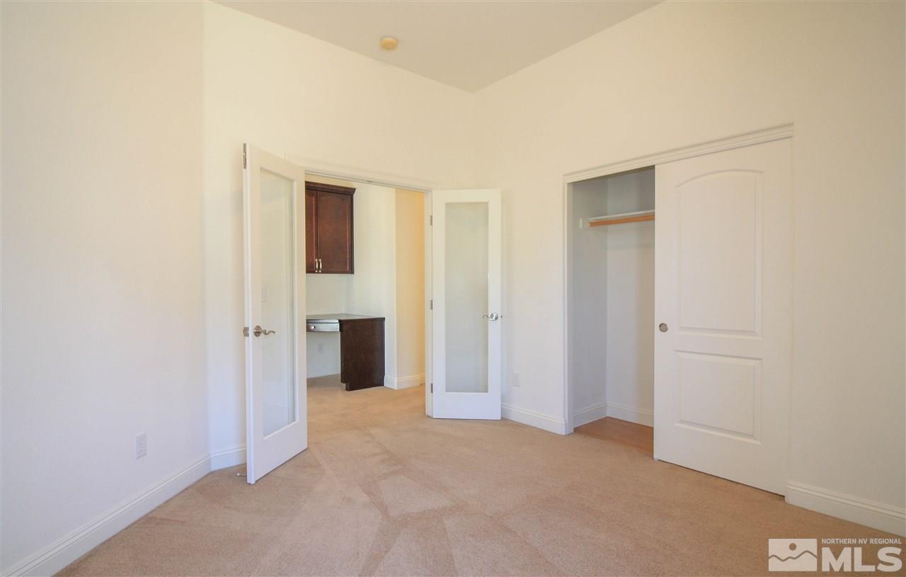 7505 Rough Rock Drive Reno, NV 89502 - Photo 13 of 25 an empty room with windows and closet