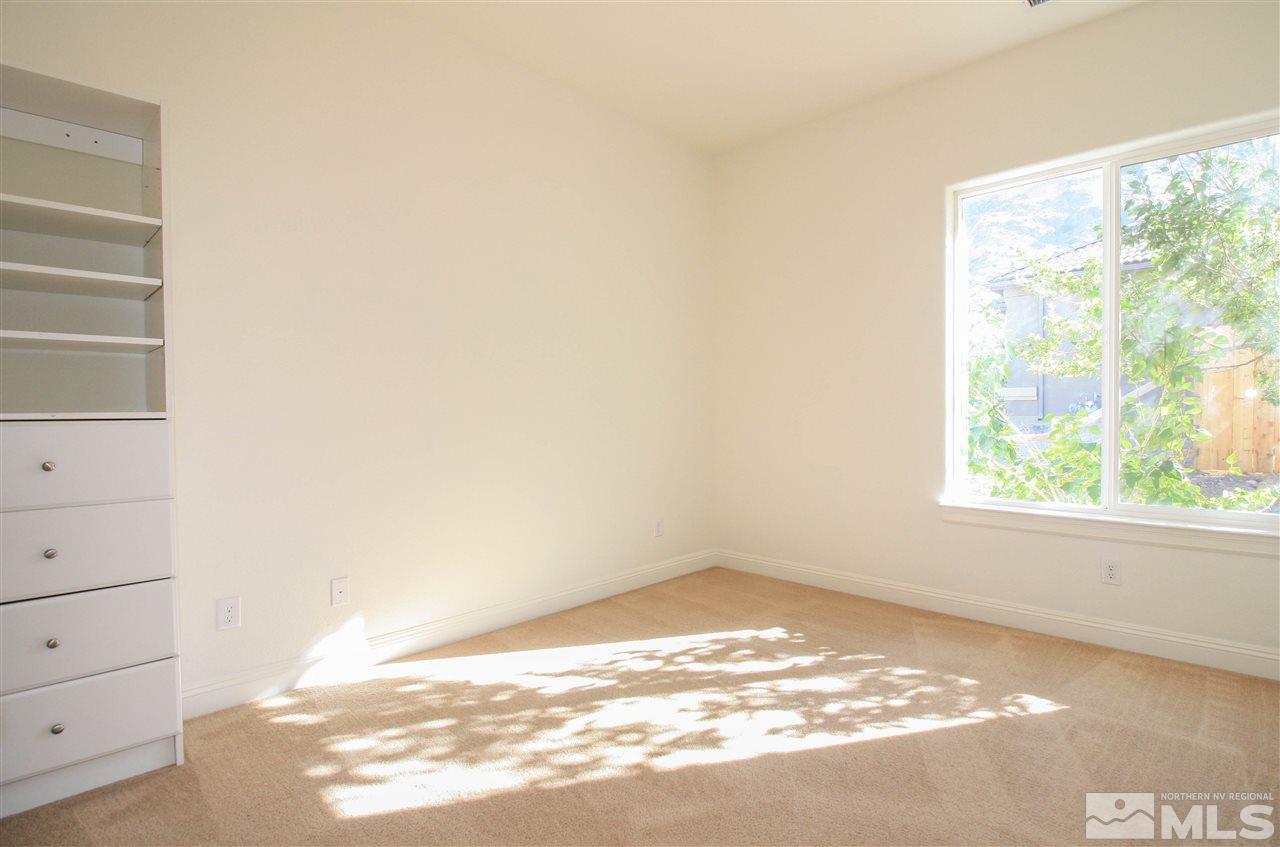 7505 Rough Rock Drive Reno, NV 89502 - Photo 15 of 25 a view of empty room with wooden floor