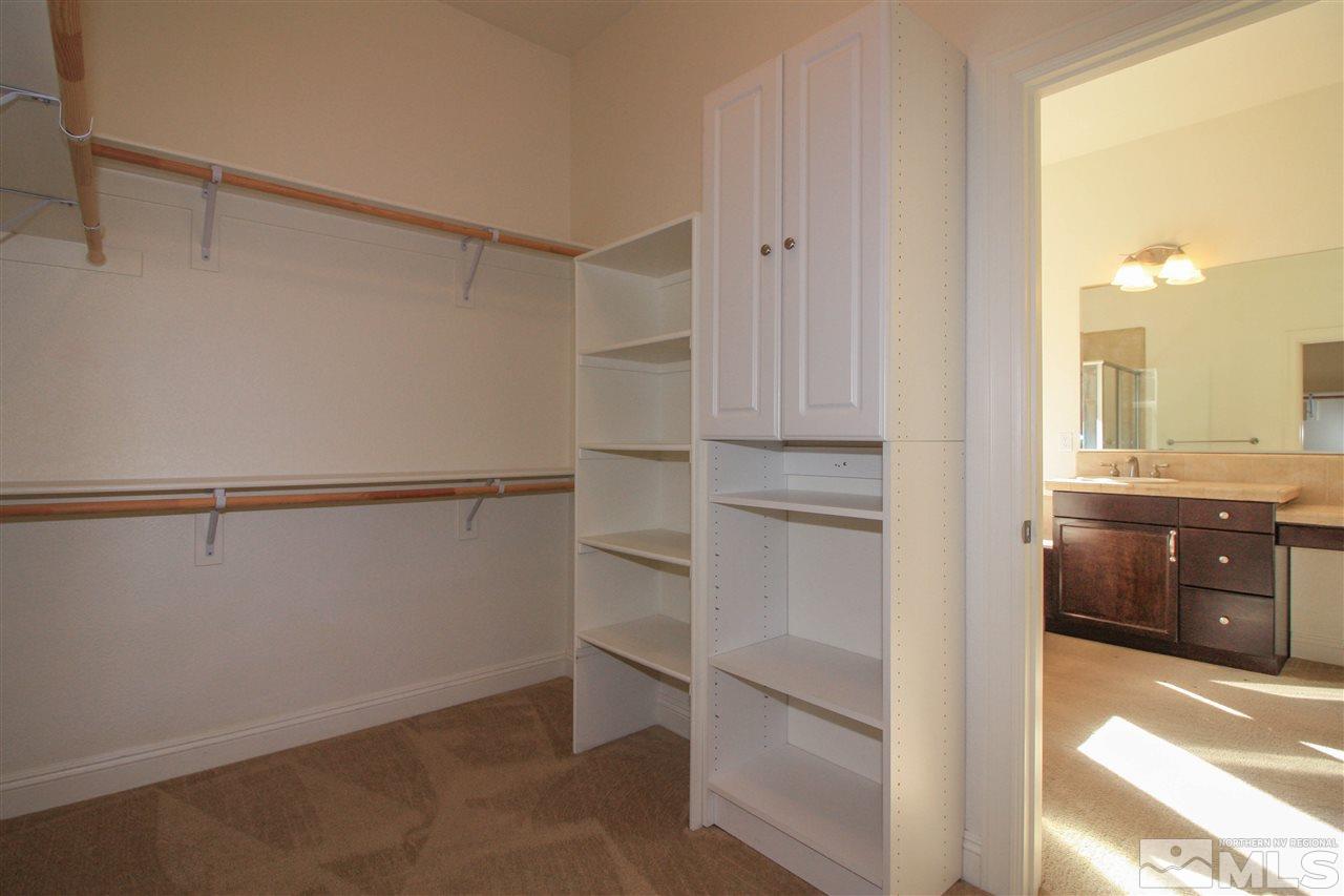 7505 Rough Rock Drive Reno, NV 89502 - Photo 21 of 25 a view of walk in closet with empty racks