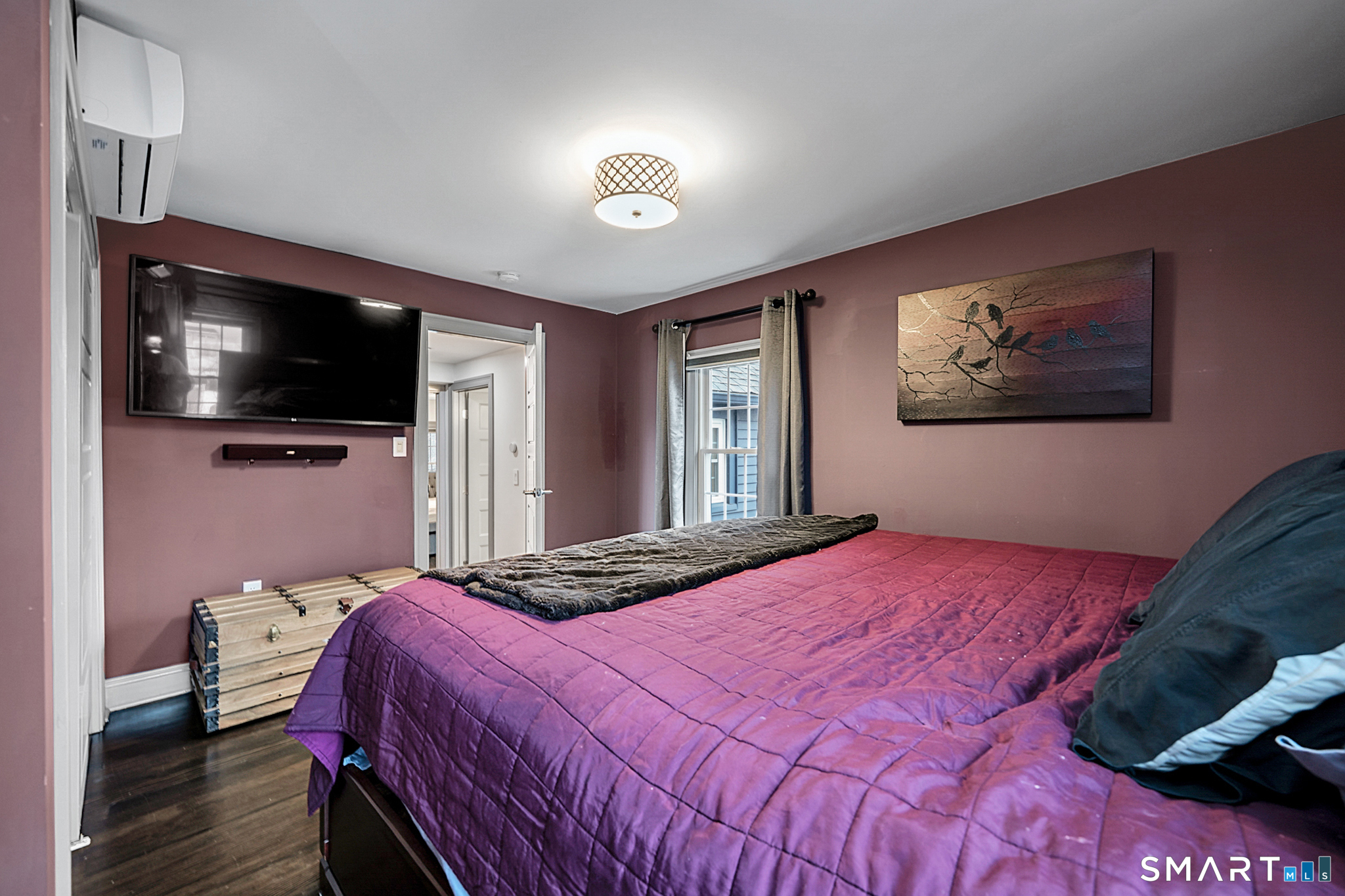 219 Prospect Avenue Meriden, CT 06451 - Photo 13 of 30 a bedroom with a bed and a flat screen tv