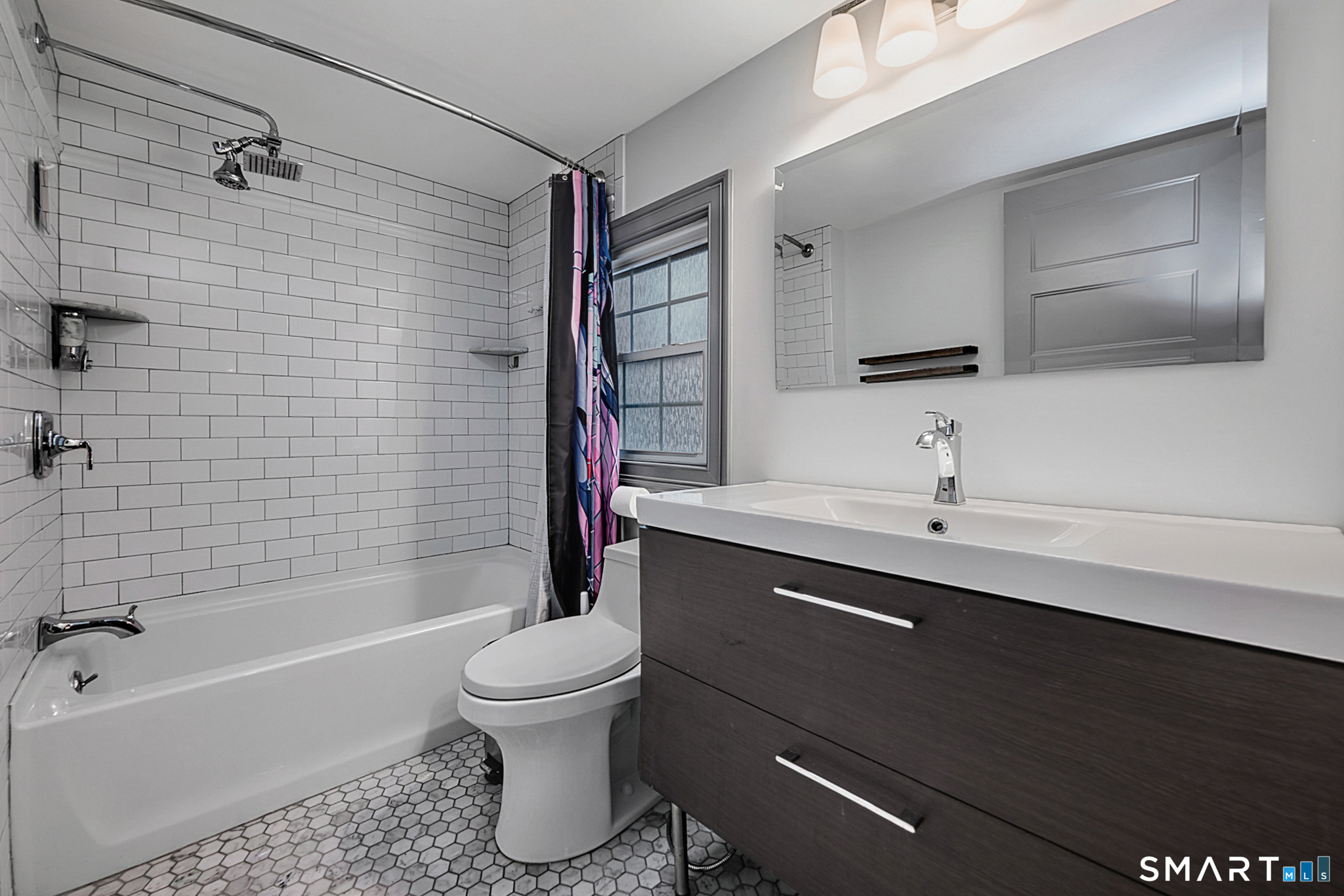 219 Prospect Avenue Meriden, CT 06451 - Photo 19 of 30 a bathroom with a sink a toilet and shower