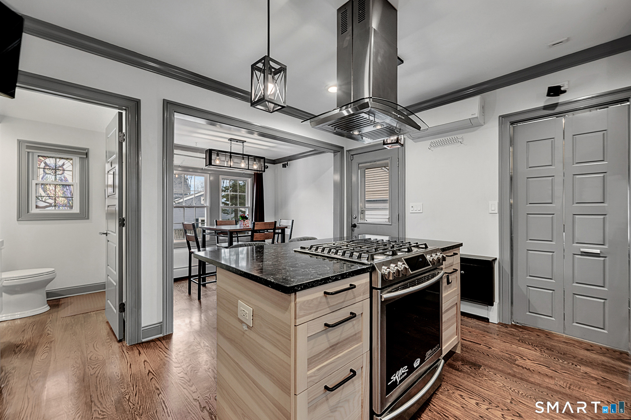 219 Prospect Avenue Meriden, CT 06451 - Photo 6 of 30 a kitchen with a stove and a wooden floor