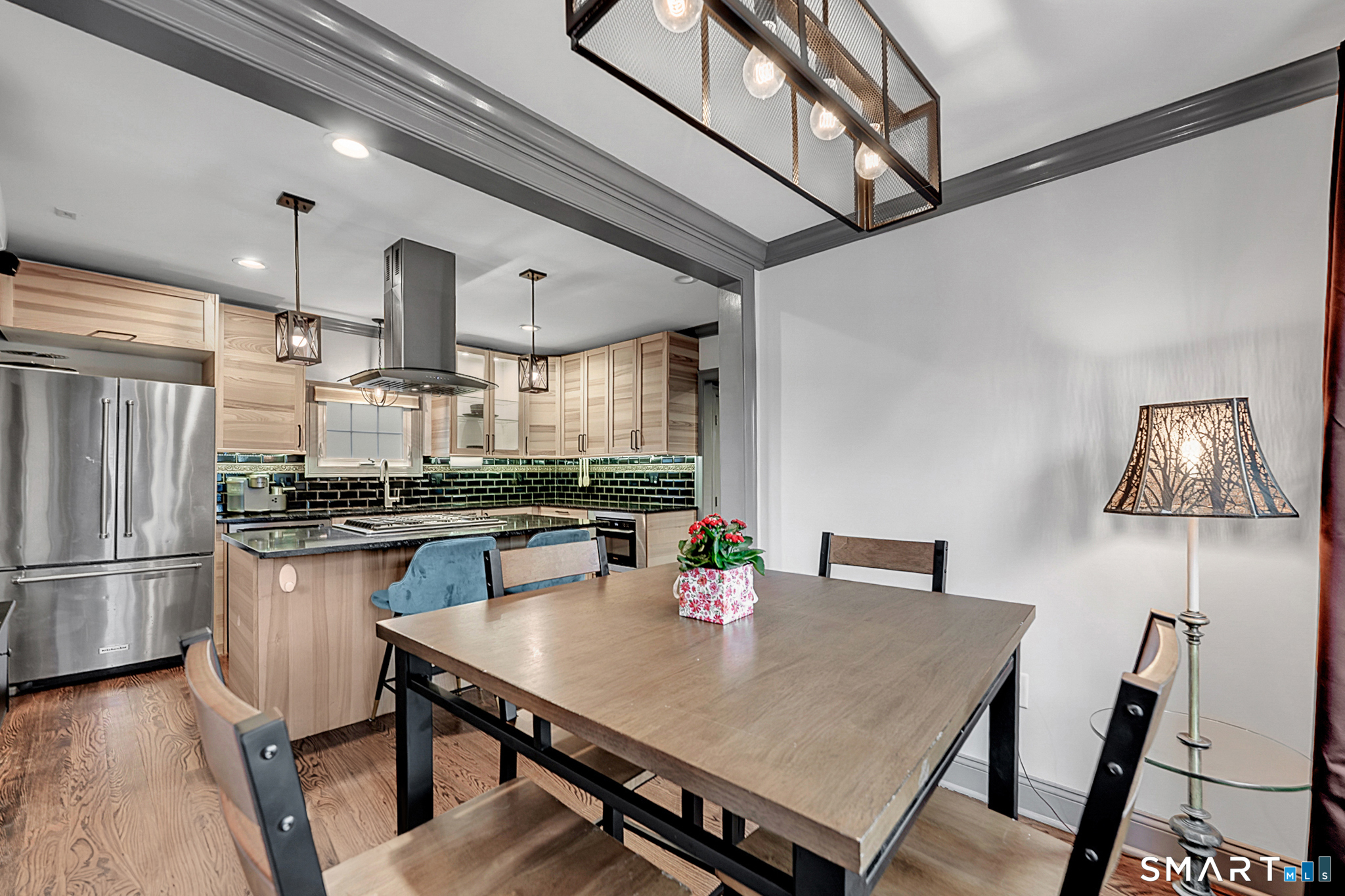 219 Prospect Avenue Meriden, CT 06451 - Photo 8 of 30 a kitchen with a table chairs and refrigerator