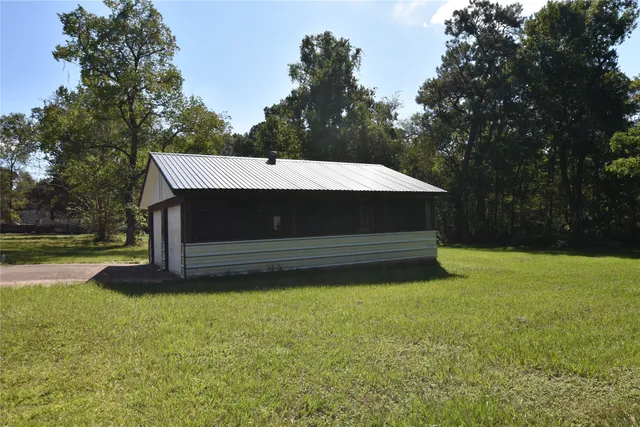 a backyard of a house with lots of green space