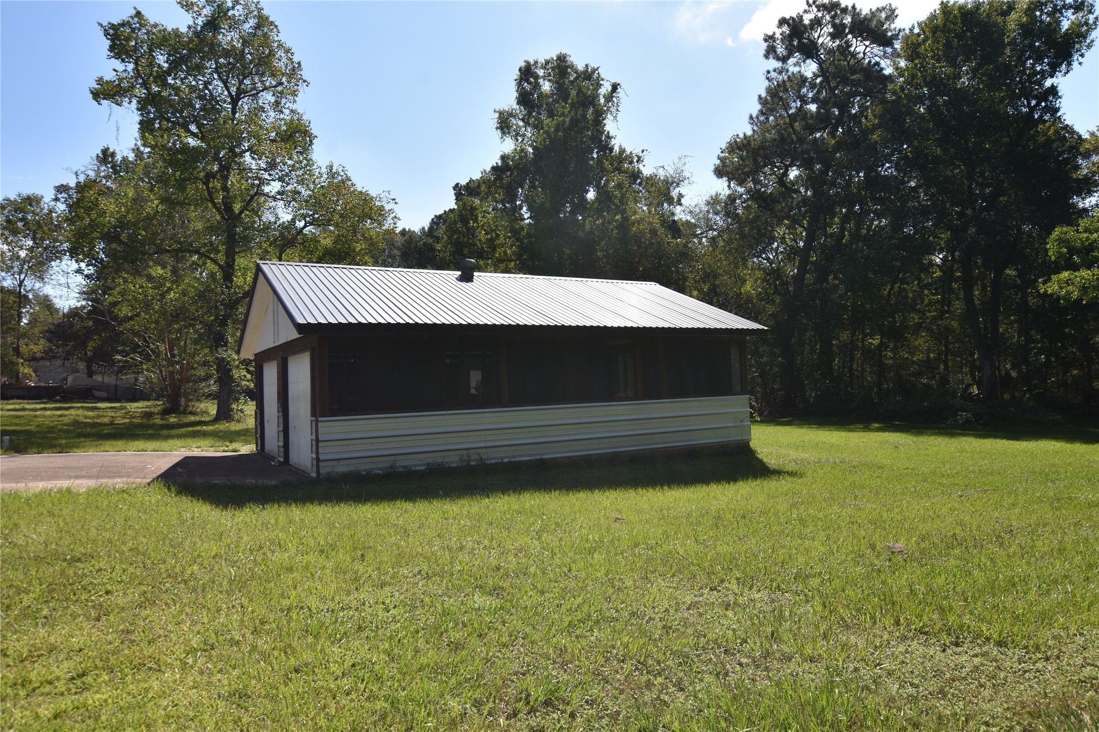 a backyard of a house with lots of green space