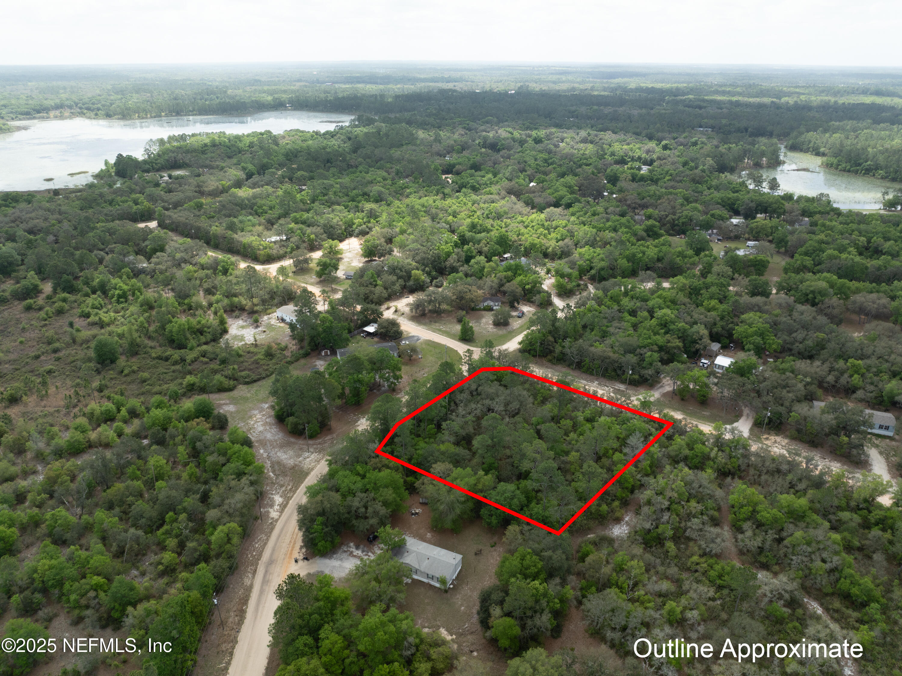 5491 Jefferson Street Keystone Heights, FL 32656 - Photo 5 of 14 an aerial view of a forest with houses