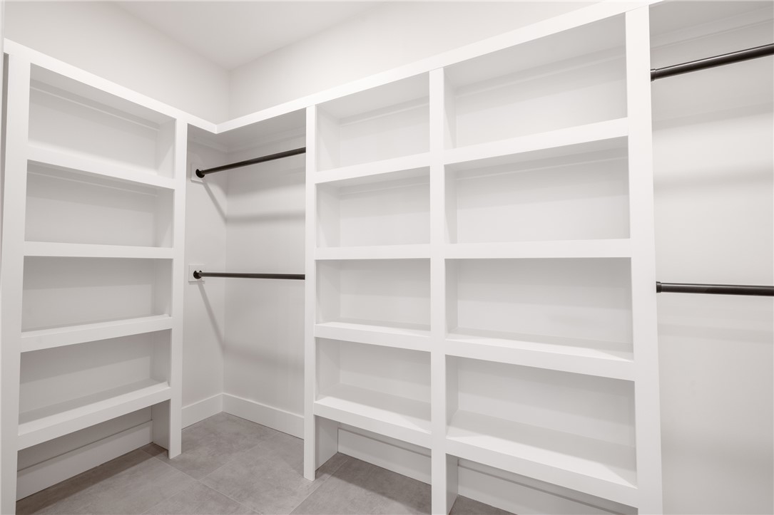 502 Point Road Westminster, SC 29693 - Photo 19 of 45 This spacious closet offers custom built-in shelving and ample hanging space.