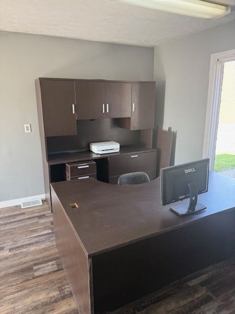 806 Four Seasons Road Bloomington, IL 61701 - Photo 16 of 23 a view of a room with wooden floor and chair