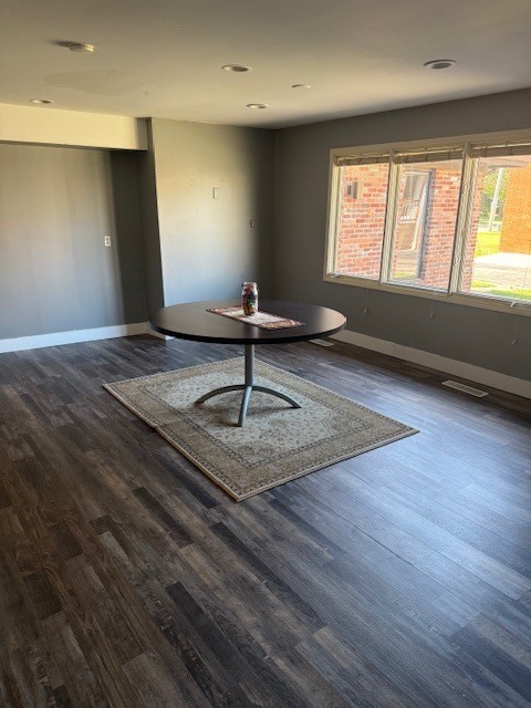 806 Four Seasons Road Bloomington, IL 61701 - Photo 18 of 23 a view of a room with wooden floor and windows