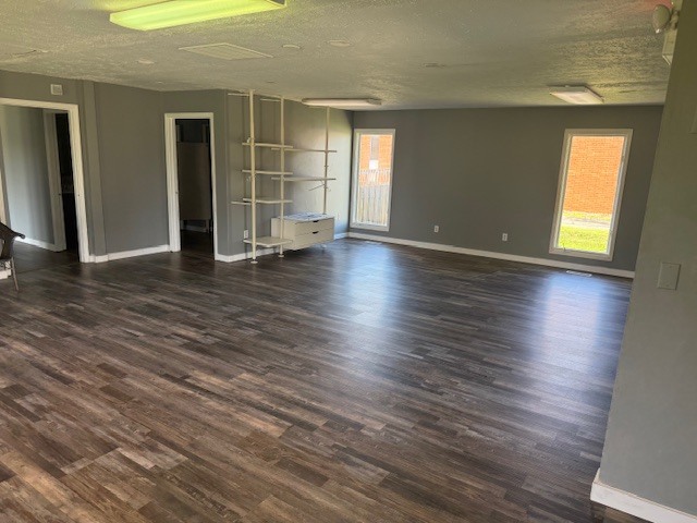 806 Four Seasons Road Bloomington, IL 61701 - Photo 6 of 23 an empty room with wooden floor and windows
