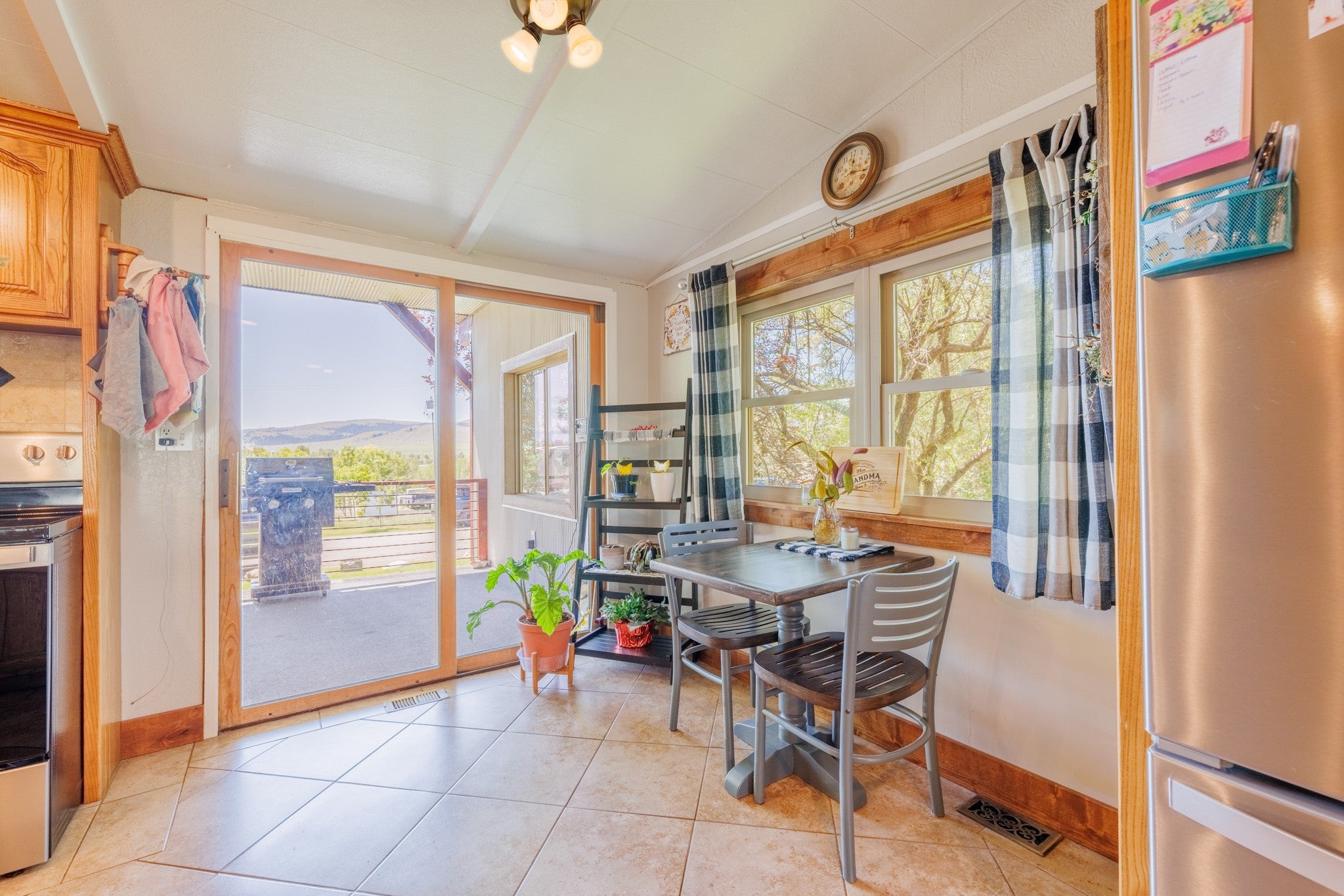 58 Gilman Road Garrison, MT 59731 - Photo 25 of 91 Dining space with lofted ceiling and light tile patterned floors