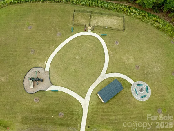 a view of swimming pool with a big yard