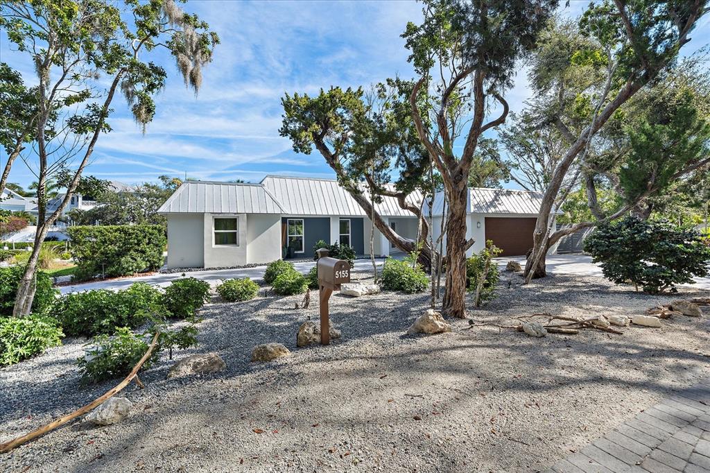 a backyard of a house with seating space