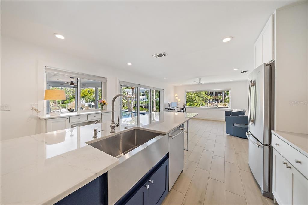 5155 Hidden Harbor Road Sarasota, FL 34242 - Photo 21 of 56 a kitchen with counter top space and windows
