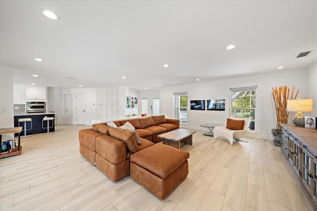 5155 Hidden Harbor Road Sarasota, FL 34242 - Photo 23 of 56 a living room with furniture and a wooden floor