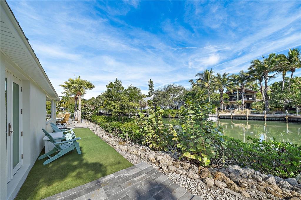 5155 Hidden Harbor Road Sarasota, FL 34242 - Photo 36 of 56 a view of a lake with a house in the background