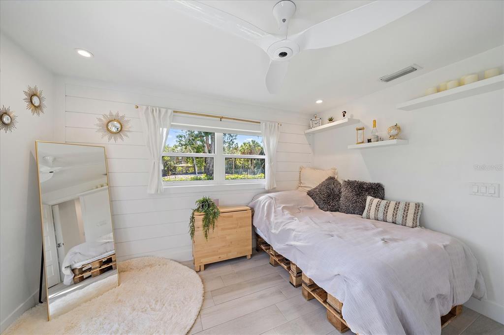 5155 Hidden Harbor Road Sarasota, FL 34242 - Photo 37 of 56 a bedroom with a bed and a table