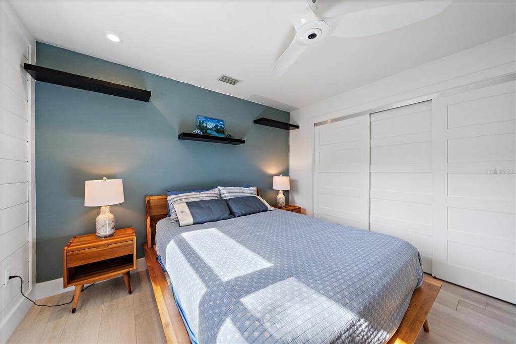 5155 Hidden Harbor Road Sarasota, FL 34242 - Photo 42 of 56 a bedroom with a bed and a chair