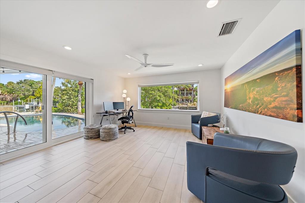5155 Hidden Harbor Road Sarasota, FL 34242 - Photo 45 of 56 a living room with furniture and a large window