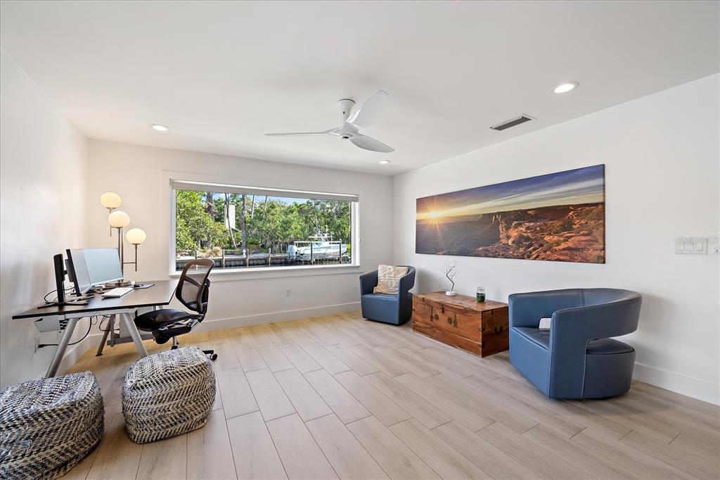 5155 Hidden Harbor Road Sarasota, FL 34242 - Photo 46 of 56 a living room with furniture a window and a chandelier