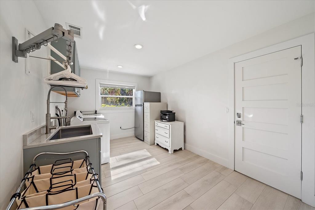 5155 Hidden Harbor Road Sarasota, FL 34242 - Photo 49 of 56 a view of a workspace with furniture and a window