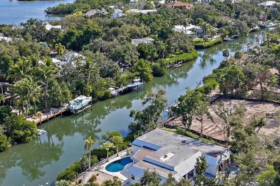 5155 Hidden Harbor Road Sarasota, FL 34242 - Photo 5 of 56 an aerial view of a house with a lake view